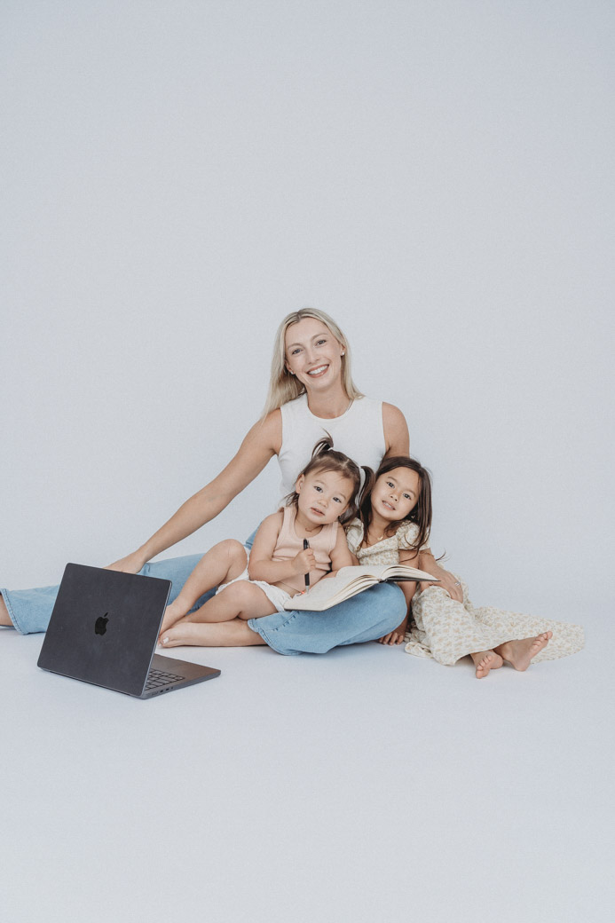 Zoe with her two daughters and a laptop
